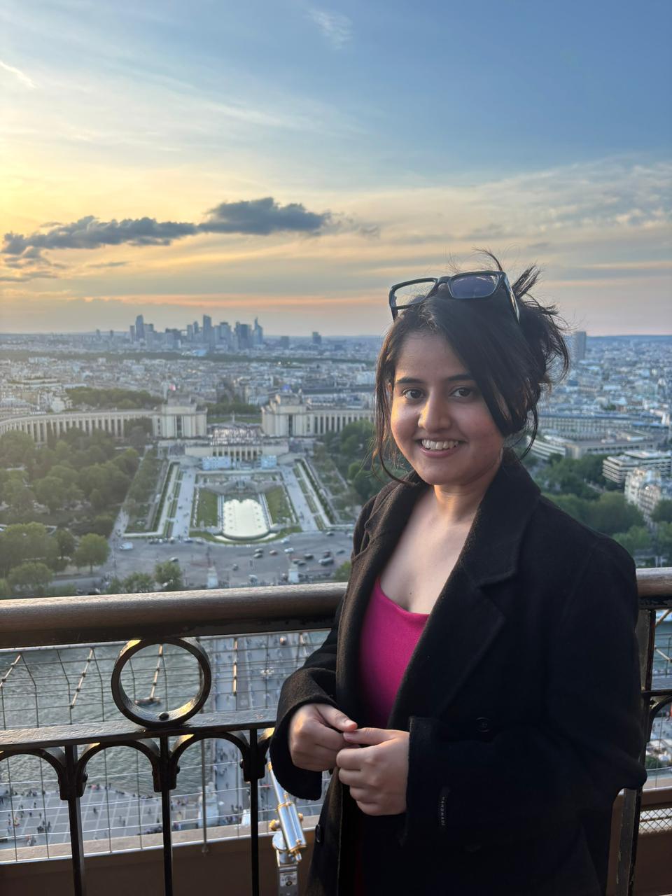 Surabhi Jha, photographed on the Eiffel Tower with Paris behind her